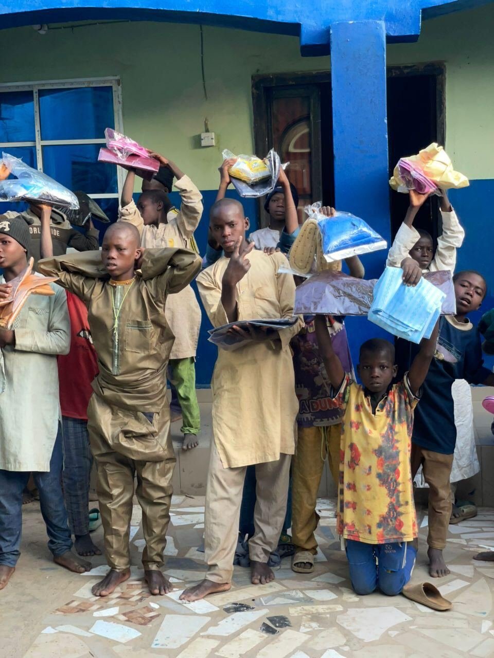 Boys showing the gifts they received