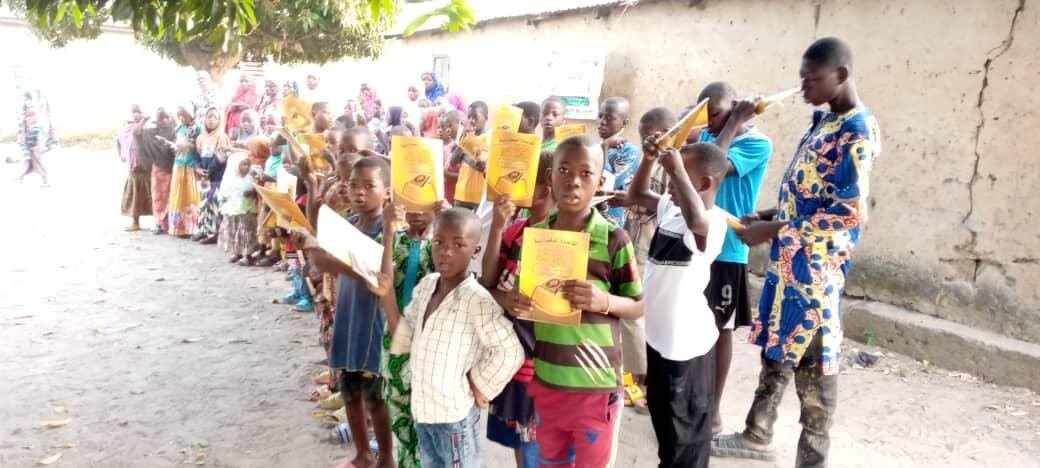 Children lining up for Qurans