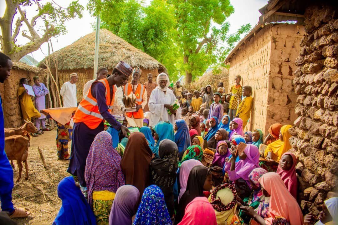 A village crowd at a Quran distribution