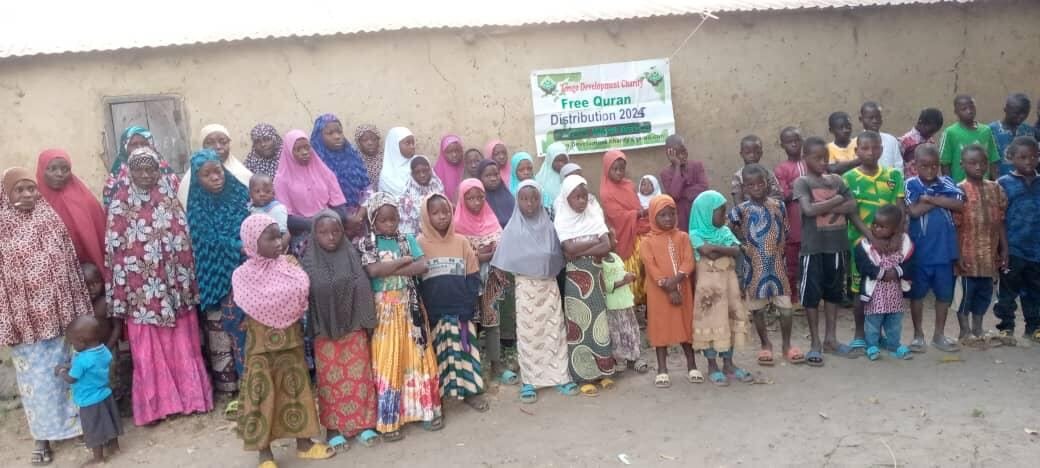 Women lined up beside the distribution banner